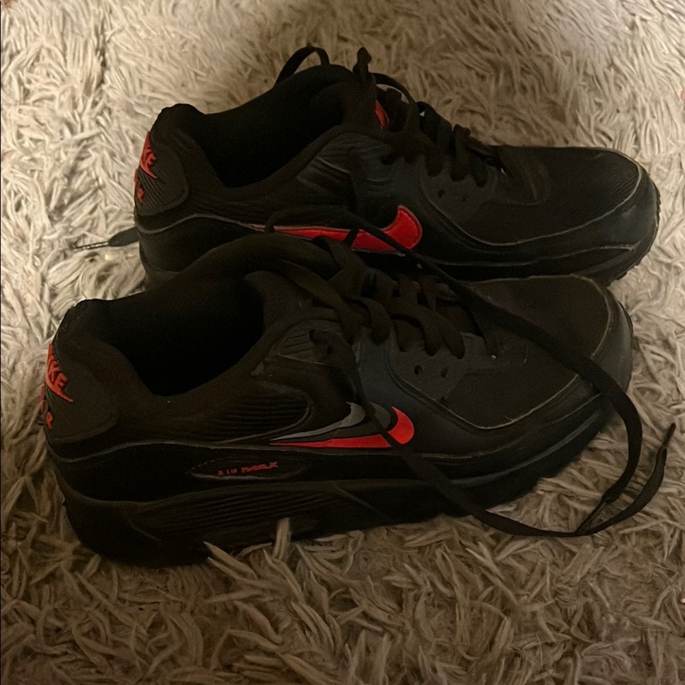 Nike Black and Red Sneakers with Iconic Swoosh